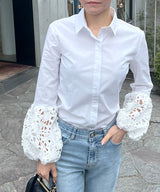 Lace blouse with voluminous sleeves